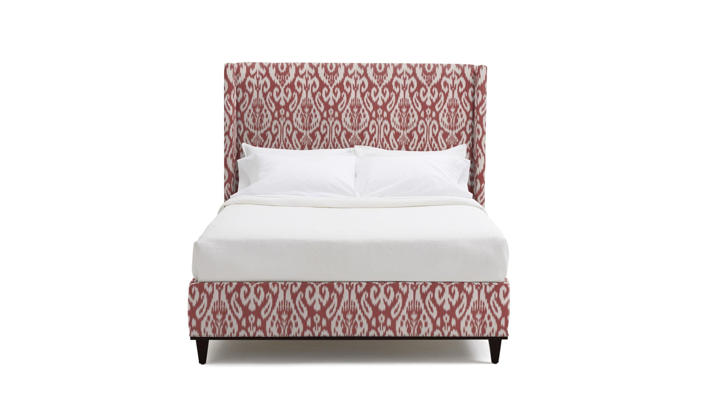 Upholstered Bed in fabric featuring a red and pink damask pattern.