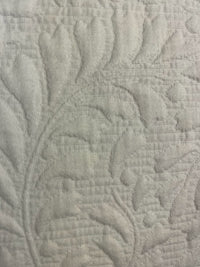 Close-up of textured fabric with leaf pattern