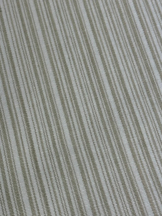 Close up of Beige striped fabric intended for use in home decor and upholstery.