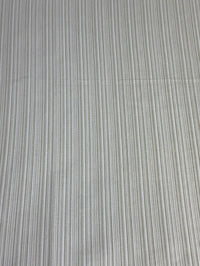 Beige striped fabric intended for use in home decor and upholstery.