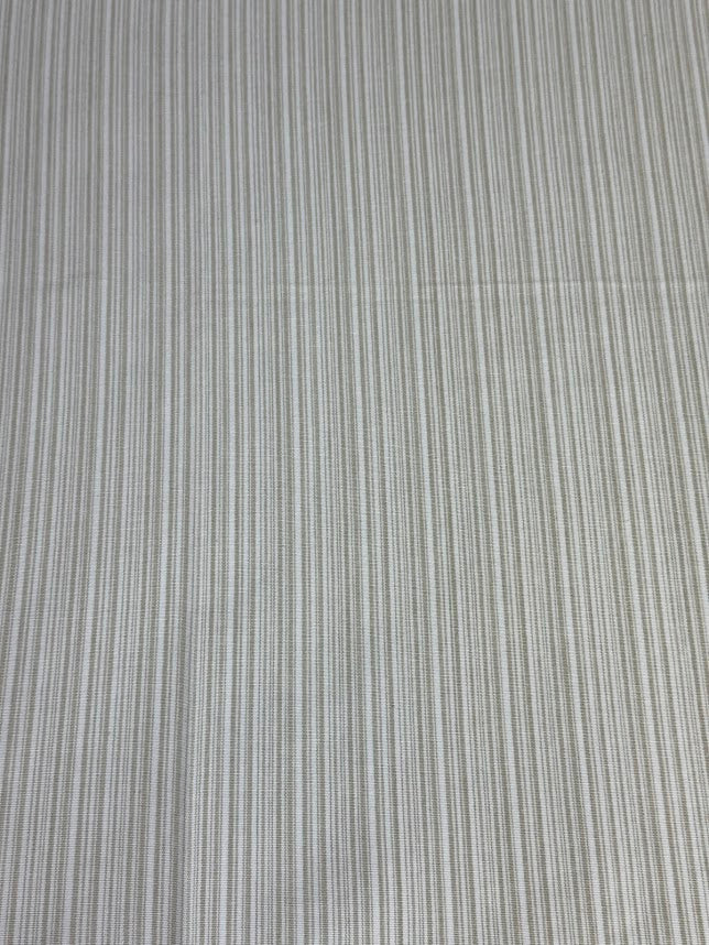 Beige striped fabric intended for use in home decor and upholstery.