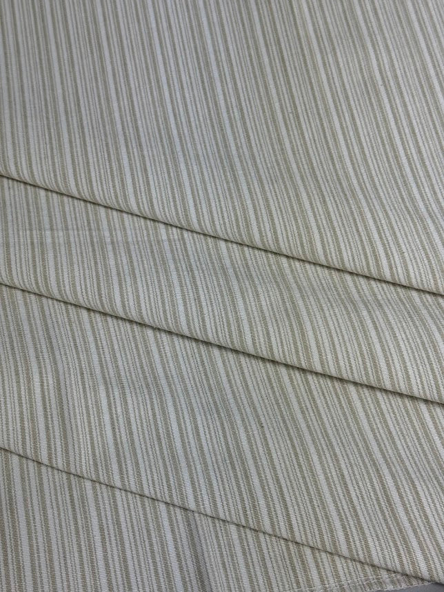 Beige striped fabric intended for use in home decor and upholstery.