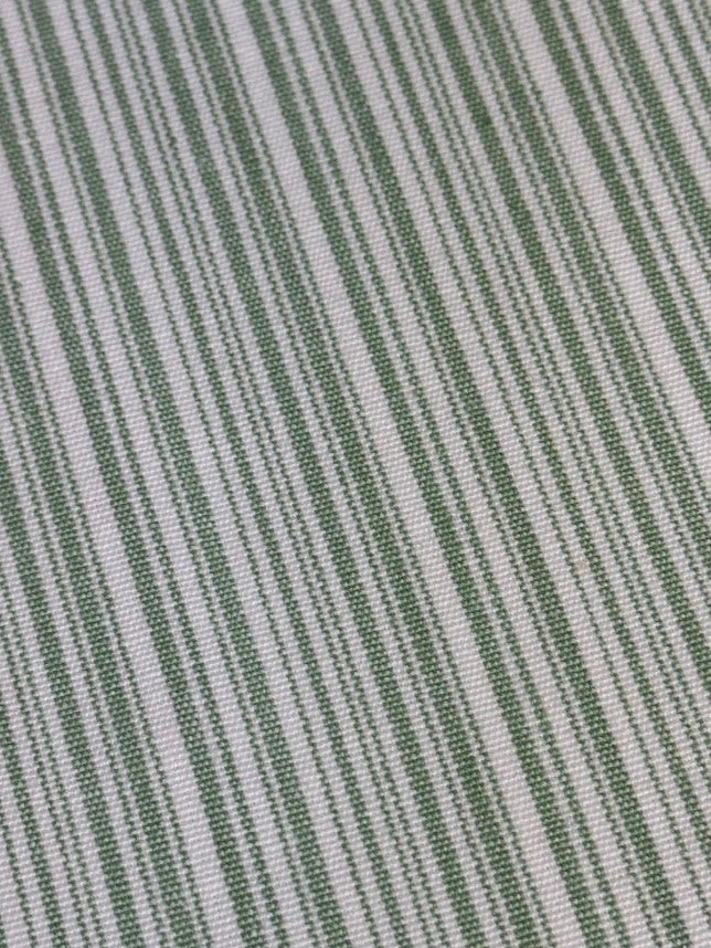 Close-up of green and white striped fabric texture