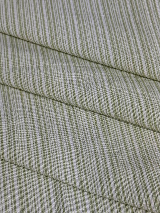 fabric featuring a small scale striped pattern in light green color