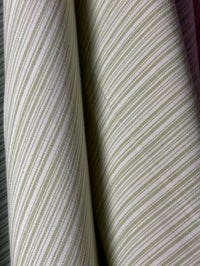 Close-up of striped fabric with green and white lines.