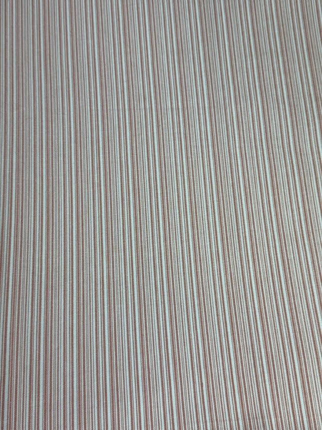 fabric featuring a small scale pink stripe pattern.