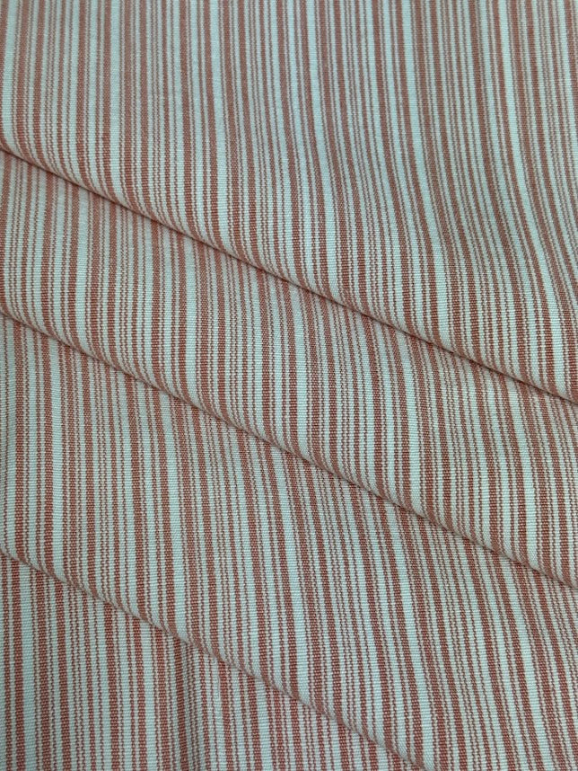 fabric featuring a small scale pink stripe pattern.