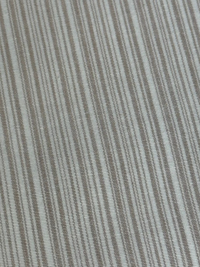  fabric featuring a small scale striped pattern in lavender tones