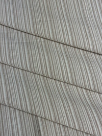  fabric featuring a small scale striped pattern in lavender tones
