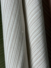  fabric featuring a small scale striped pattern in lavender tones
