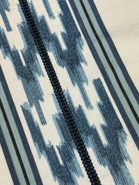 blue embroidered stripe pattern with a geometric design.