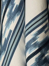 blue embroidered stripe pattern with a geometric design.