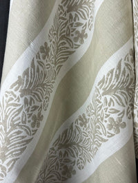 Close-up of fabric with floral pattern stripe on a light background