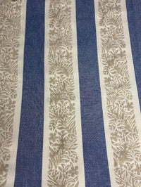 Fabric featuring a striped pattern with leaves in blue, taupe, and tan colors.