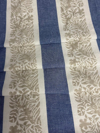 Fabric featuring a striped pattern with leaves in blue, taupe, and tan colors.