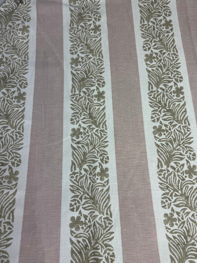 fabric featuring a striped pattern with varying shades of pink, purple, and white colors, with a leaf print design.