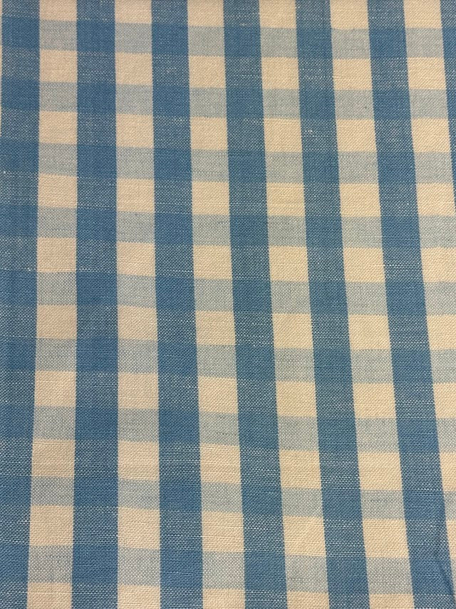 A close-up view of a fabric with a small checkered pattern in French Blue color.