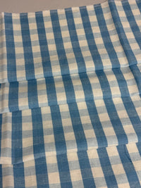 A close-up view of a fabric with a small checkered pattern in French Blue color.