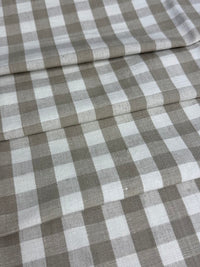 Linen fabric with a small check pattern, in beige and white colors.