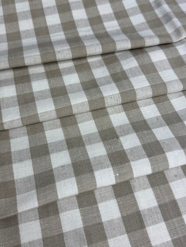 Linen fabric with a small check pattern, in beige and white colors.