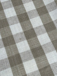 Linen fabric with a small check pattern, in beige and white colors.