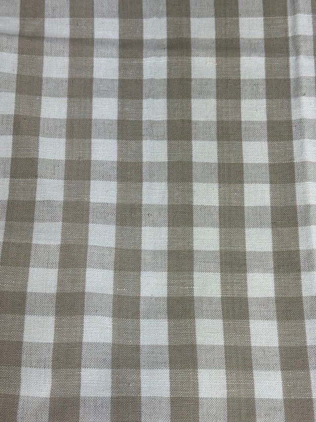 Linen fabric with a small check pattern, in beige and white colors.
