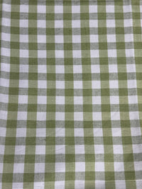 A close-up view of a fabric with a small checkered pattern in light green color.