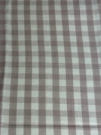 A close-up view of a fabric with a small checkered pattern in shades of lavender and purple.