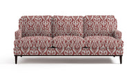 Sofa in fabric featuring a red and pink damask pattern.