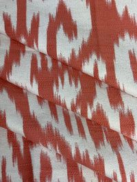 Fabric with abstract damask pattern in pink and cream