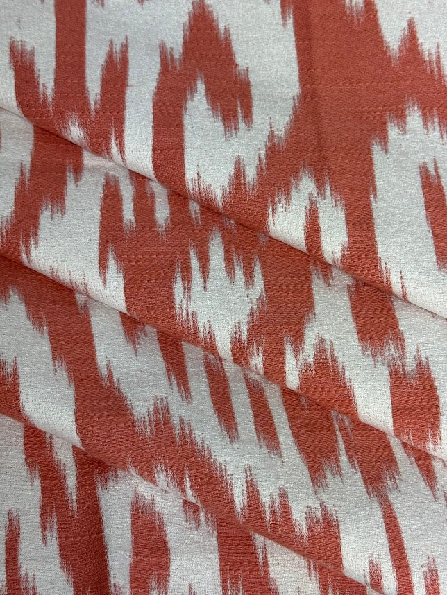 Fabric with abstract damask pattern in pink and cream