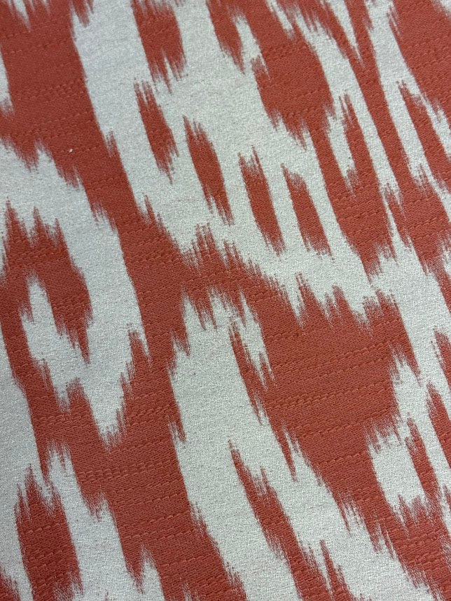 Fabric with abstract damask pattern in pink and cream