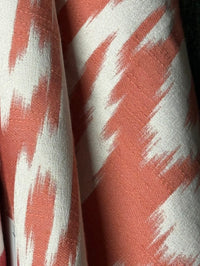 Fabric with abstract damask pattern in pink and cream