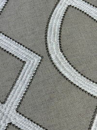 Close-up of a textured gray and white patterned rug