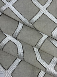 Close-up of greige fabric with white geometric pattern