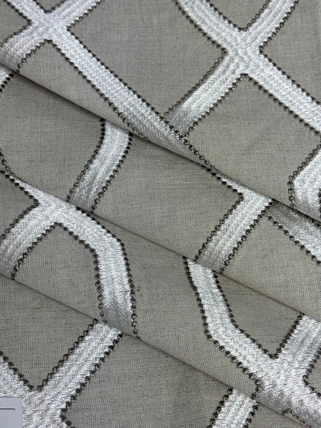 Close-up of greige fabric with white geometric pattern