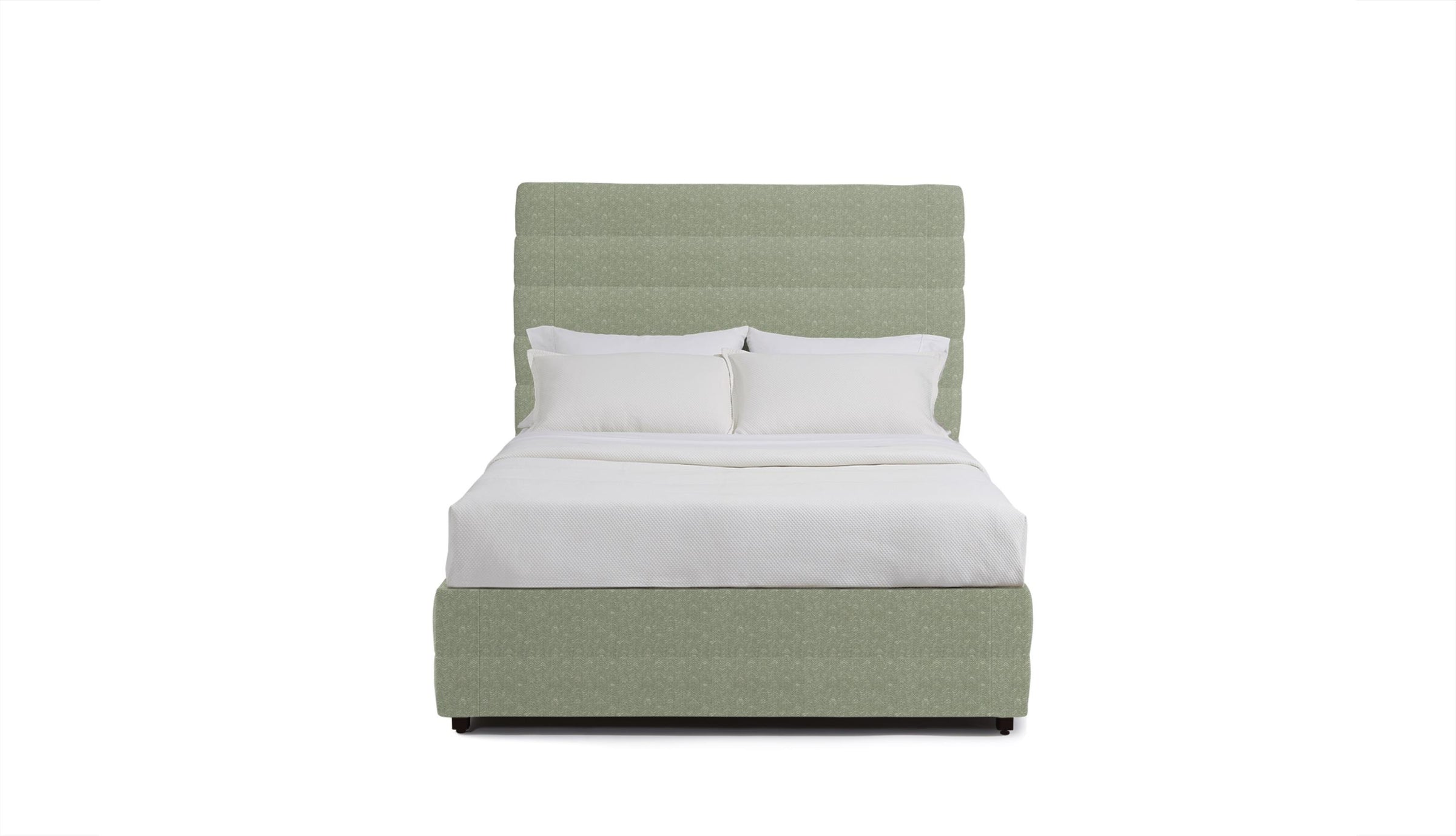 Green upholstered bed with white bedding on a white background