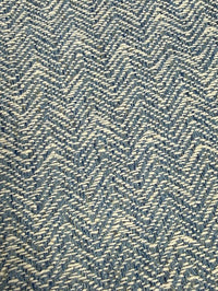 Textured fabric with a herringbone pattern in blue and white.
