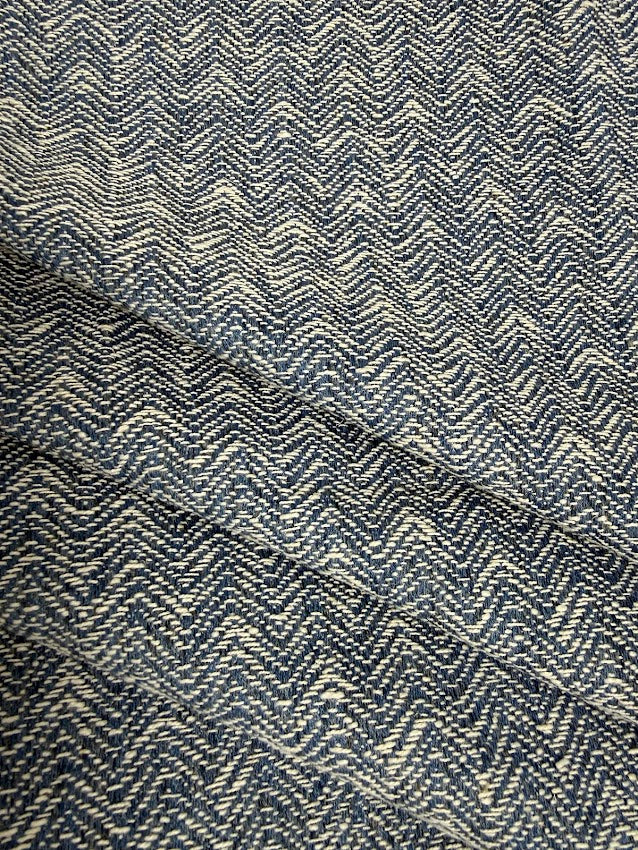 Textured fabric with a zigzag pattern in blue and white