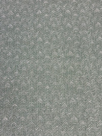 Textured green patterned fabric swatch