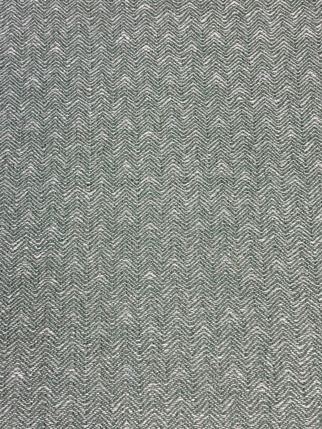 Textured green patterned fabric swatch