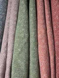 Close-up of textured fabric swatches in various colors.