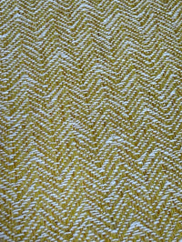 Textured fabric with a herringbone pattern in yellow and white
