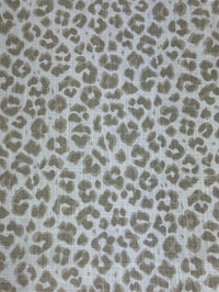 Leopard print pattern on a textured fabric background