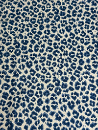 Blue leopard print pattern on a beige background