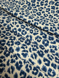 Blue leopard print fabric on a beige background