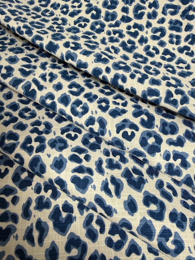 Blue leopard print fabric on a beige background