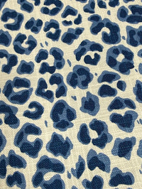 Blue leopard print pattern on a beige background