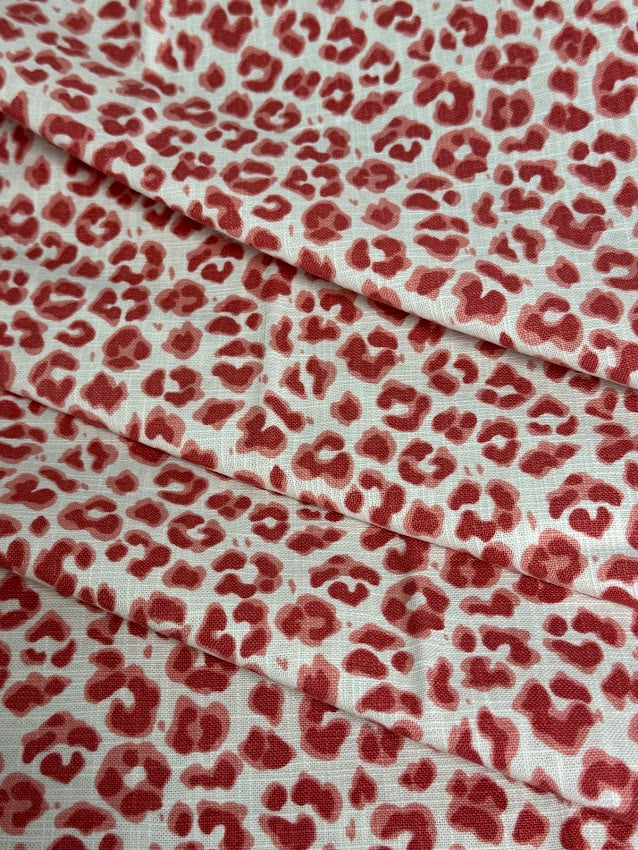 Red leopard print fabric on a white background
