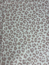 Leopard print pattern on a textured fabric background